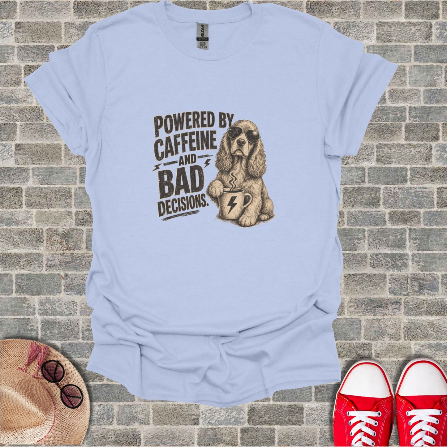 T-shirt with dog wearing sunglasses and holding coffee cup, text "Powered by Caffeine and Bad Decisions".
