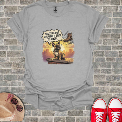 Bulldog sitting on ledge waiting for shoe to drop with text "waiting for the other shoe to drop".
