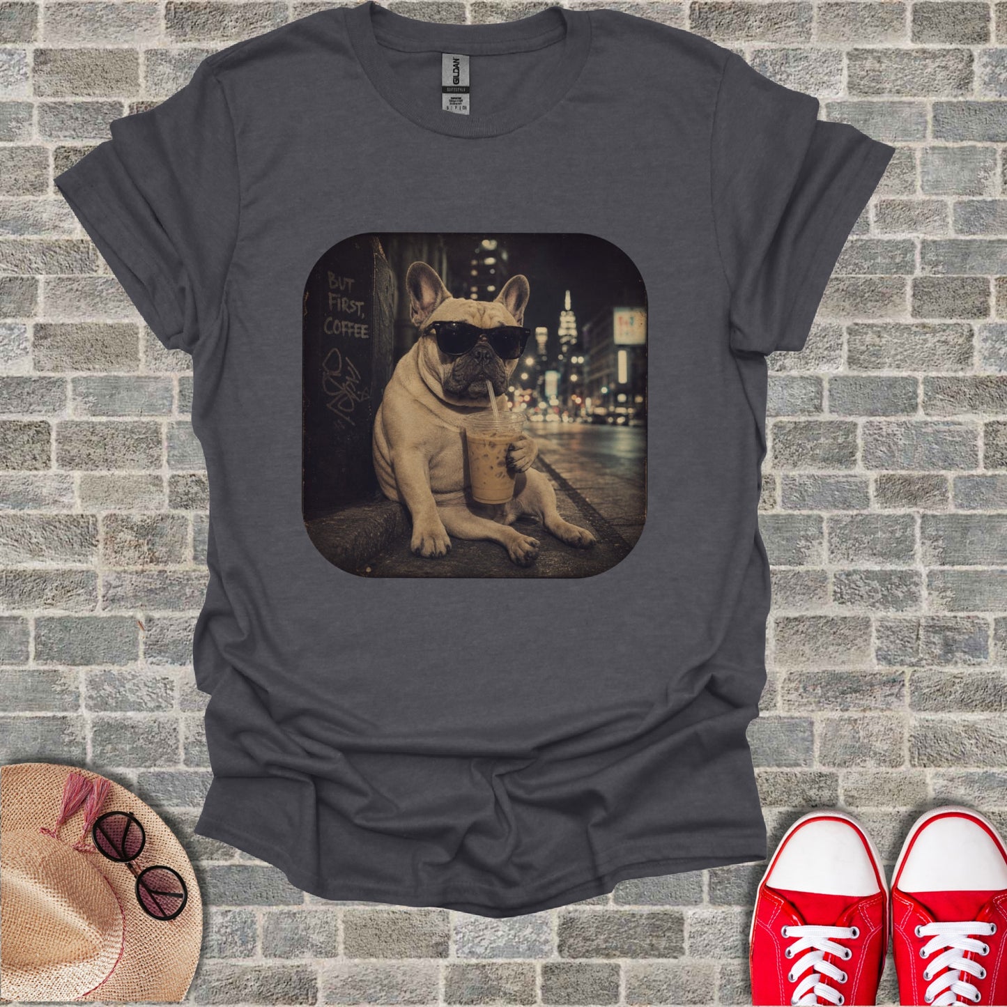 French bulldog wearing sunglasses drinks coffee with "But First, Coffee" text.