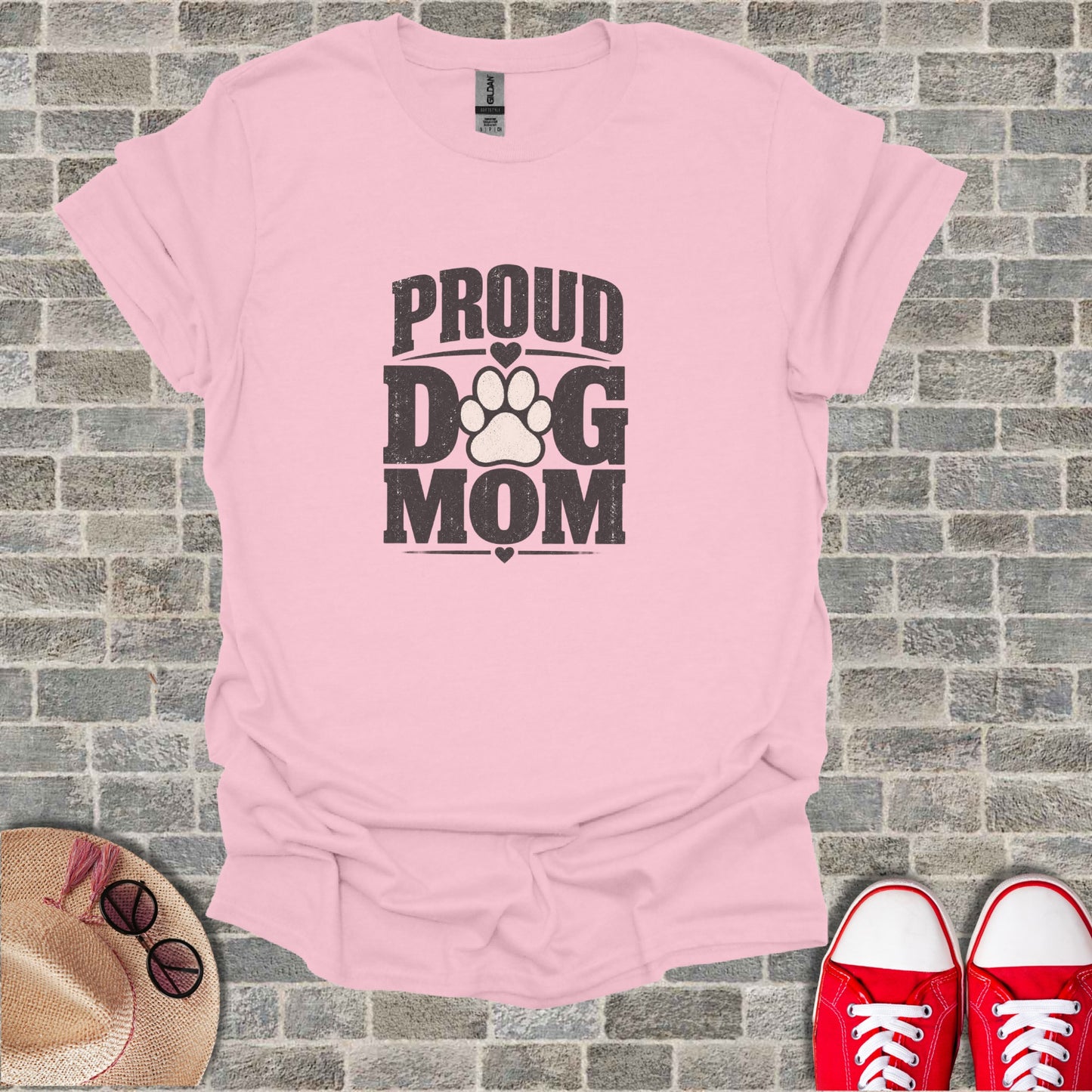 Pink t-shirt with "Proud Dog Mom" text and paw print design.