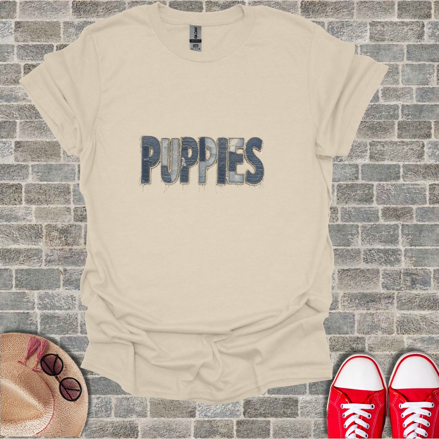 Beige t-shirt with "PUPPIES" text made of denim texture.