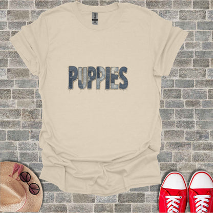 Beige t-shirt with "PUPPIES" text made of denim texture.