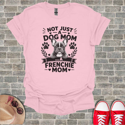 Pink t-shirt featuring a French Bulldog and text: "Not Just a Dog Mom... A Frenchie Mom".