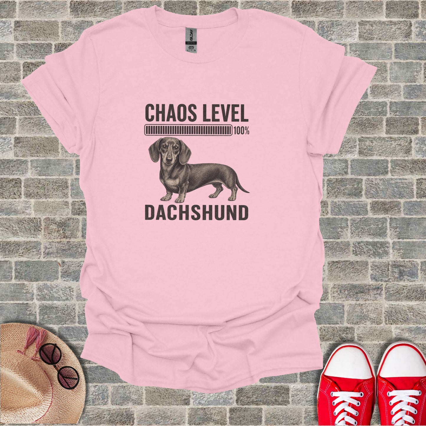 Pink t-shirt with dachshund graphic and "Chaos Level 100%" text.