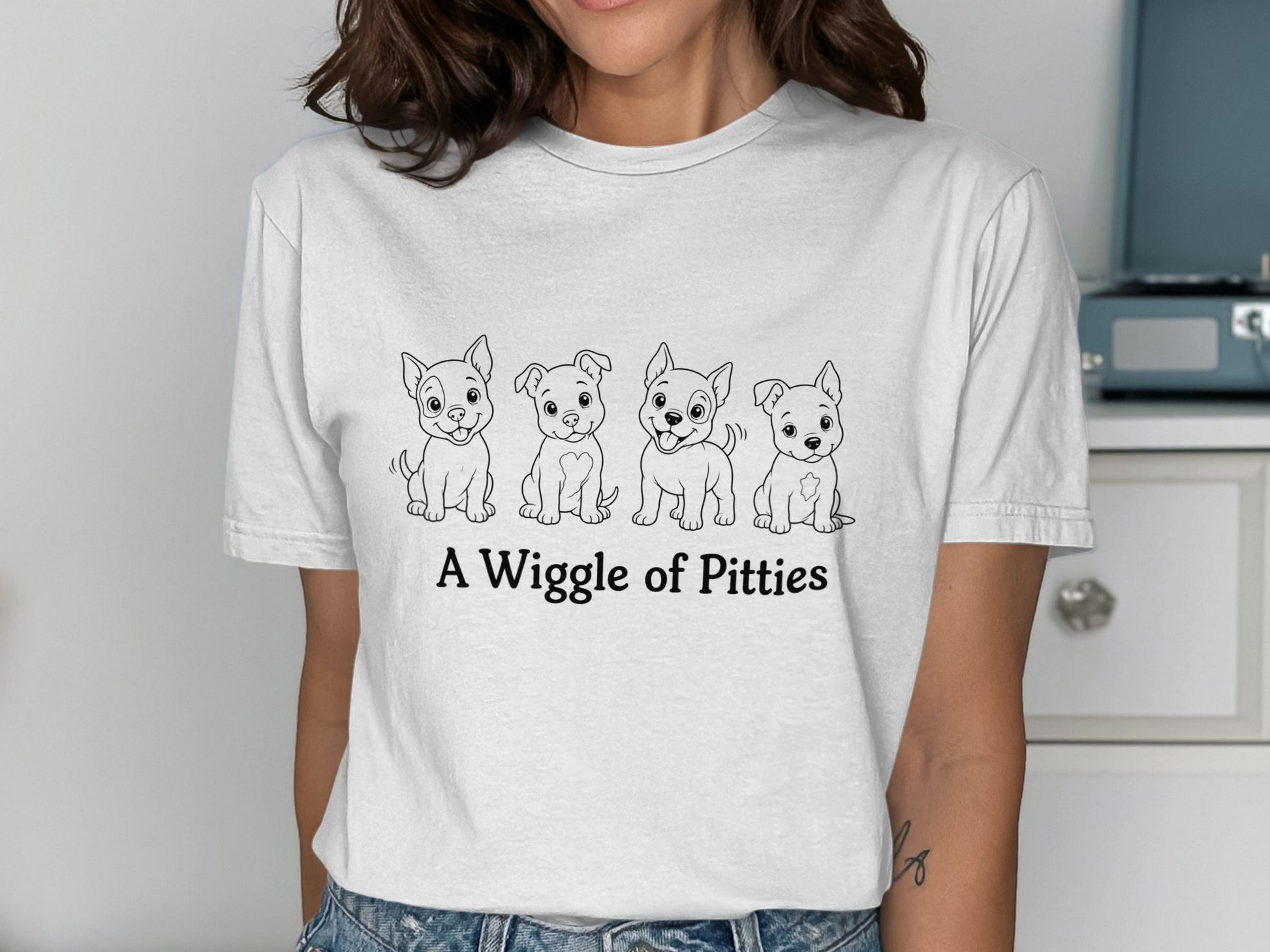 Four cartoon pitbull puppies with "A Wiggle of Pitties" text.