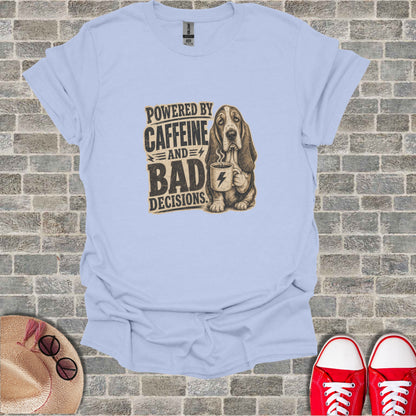 Light blue t-shirt with graphic of a basset hound holding coffee, text reads "Powered by Caffeine and Bad Decisions".