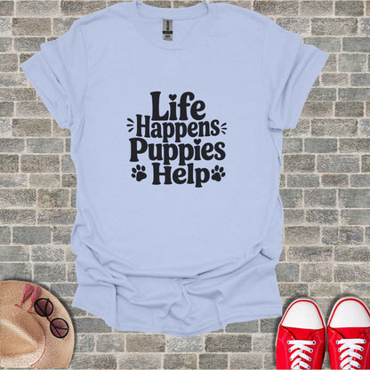 Light blue t-shirt with "Life Happens Puppies Help" text and paw prints.