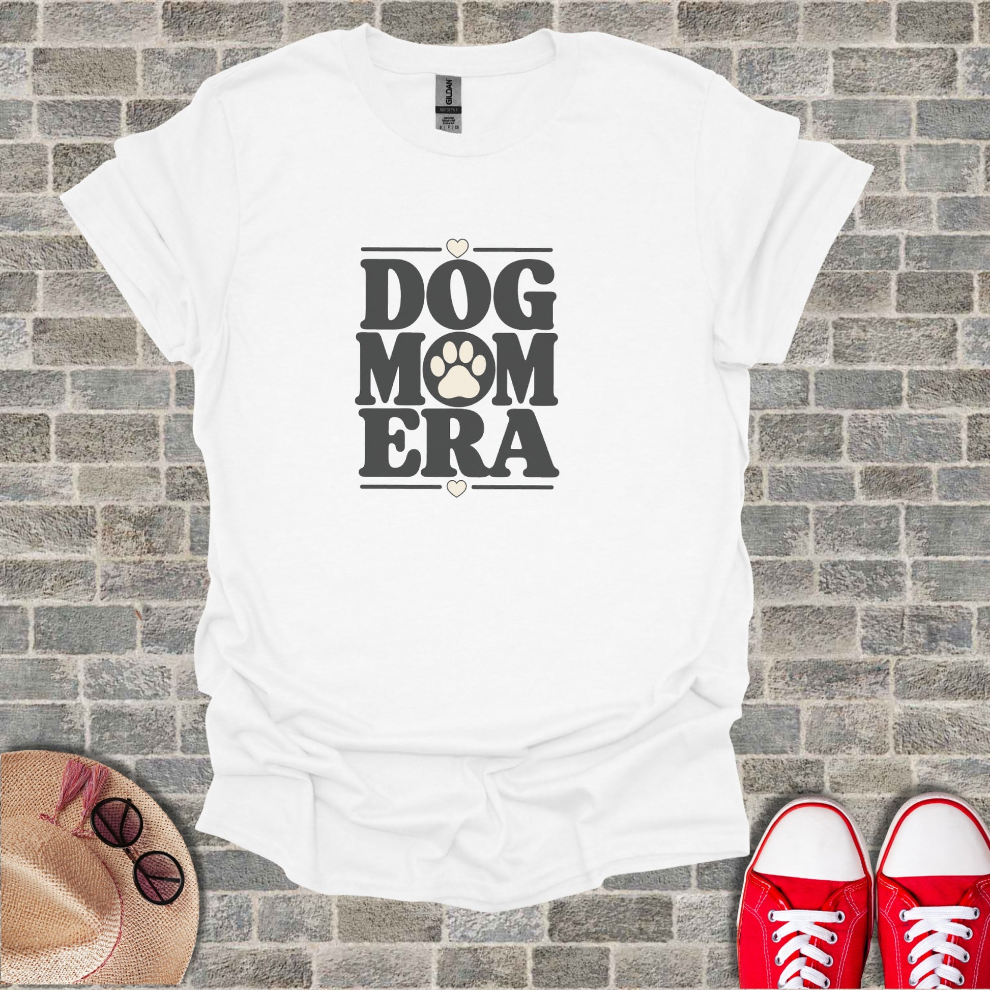 White t-shirt with "DOG MOM ERA" text and paw print.