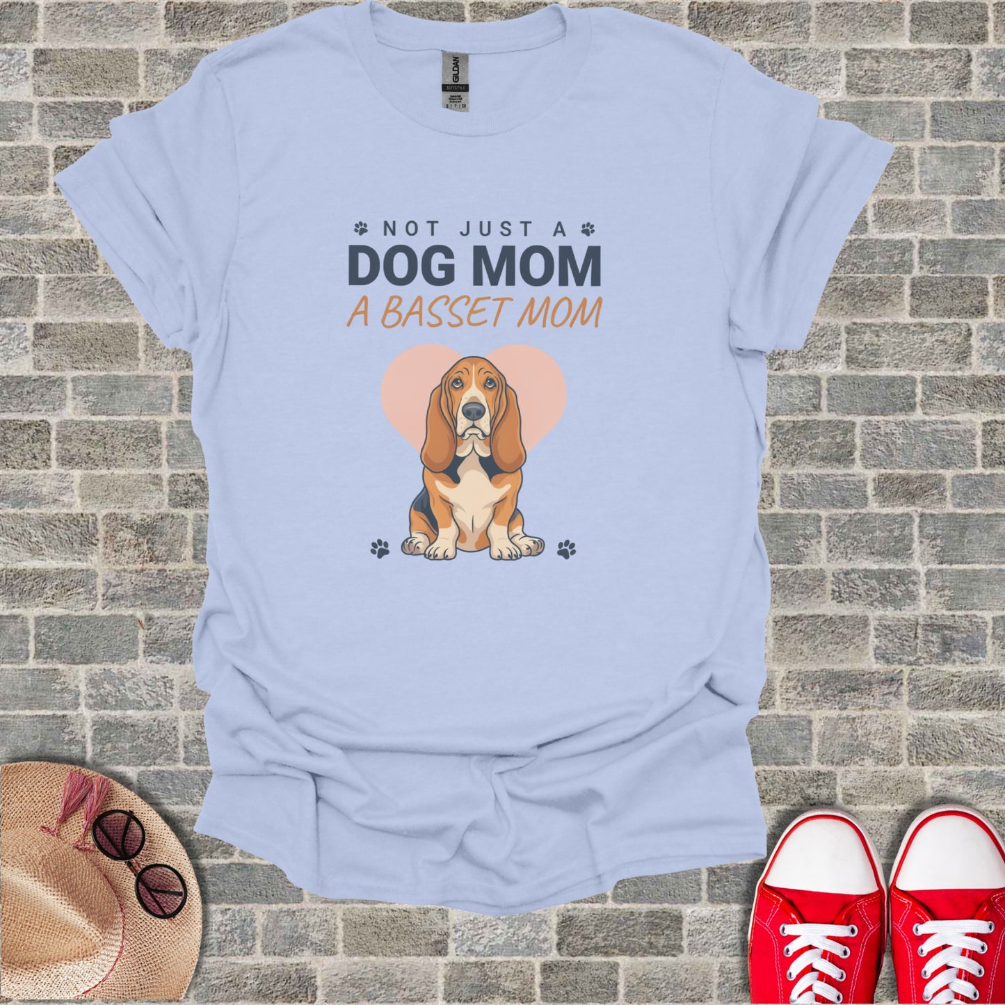 Light blue t-shirt with a Basset Hound and text "Not just a dog mom. A basset mom."