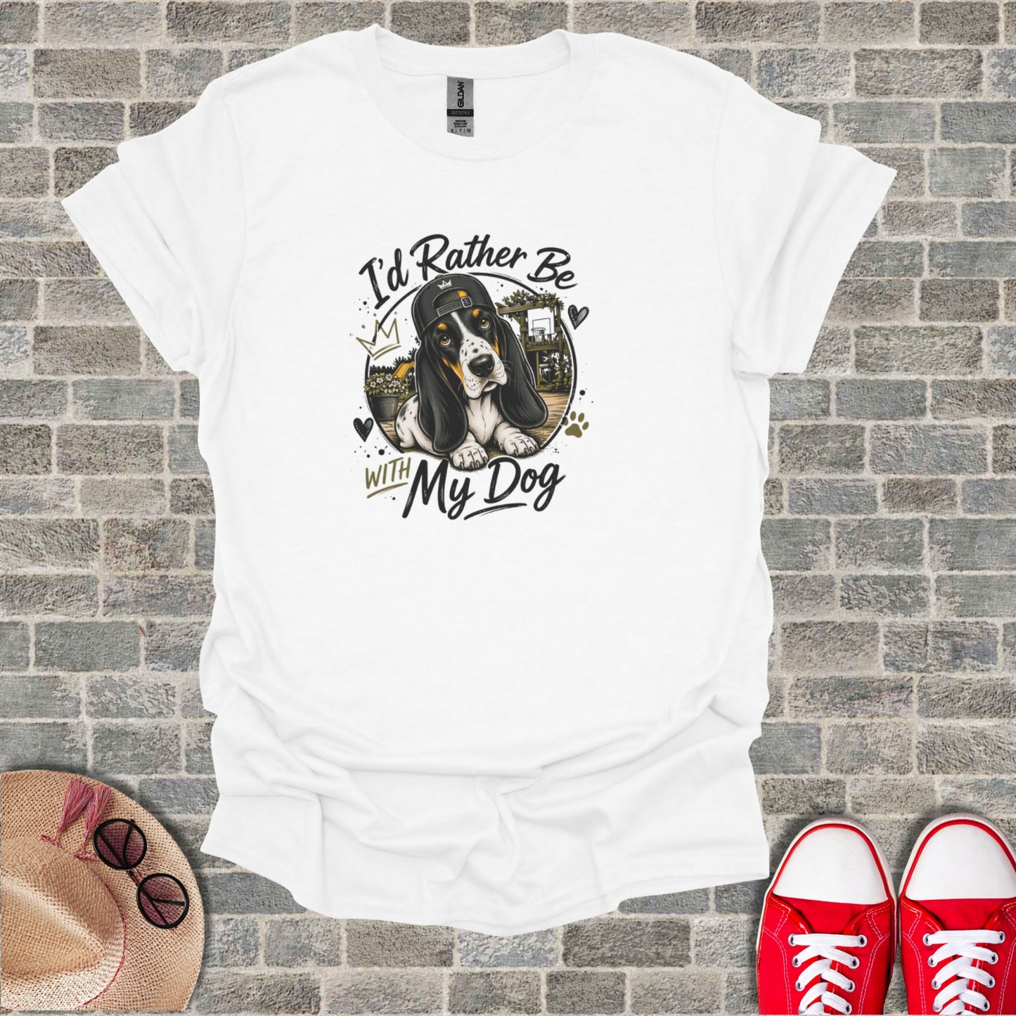 White t-shirt with graphic of a basset hound wearing a baseball cap and text "I'd Rather Be With My Dog".