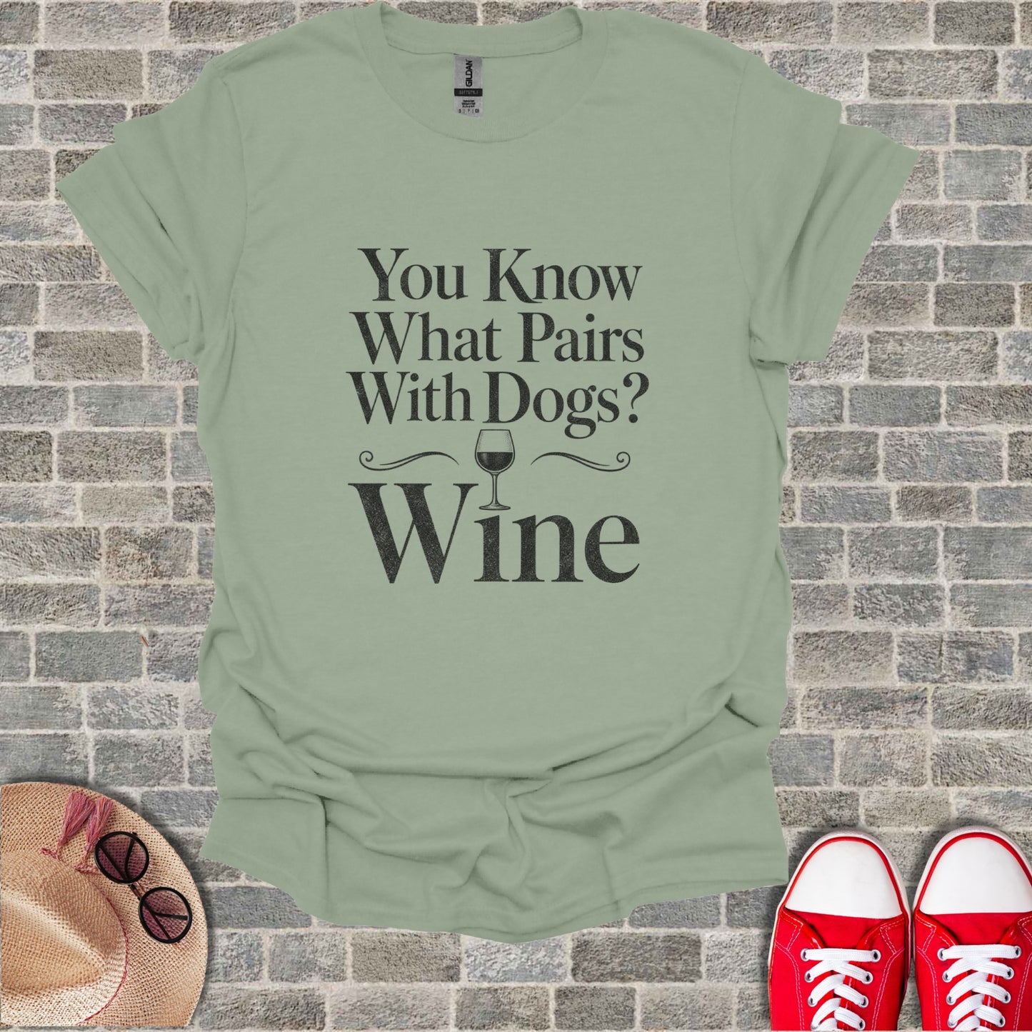 Light green t-shirt with black text: "You Know What Pairs With Dogs? Wine".