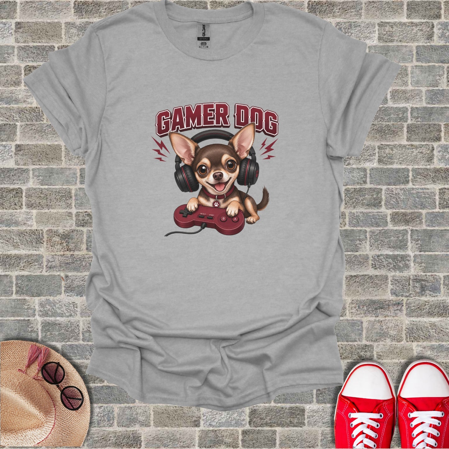 Grey t-shirt with cartoon dog wearing headphones and holding a video game controller.